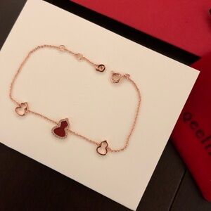 Chic Rose Gold Bracelet with Red Charms